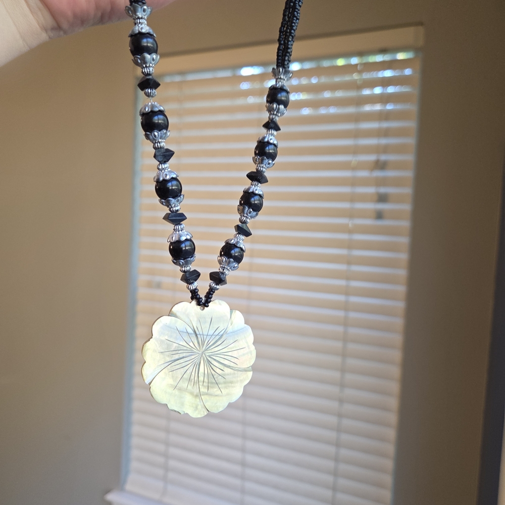 Elegant Black and Silver Beaded Necklace with Floral Pendant